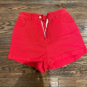 Red high waisted jean shorts.